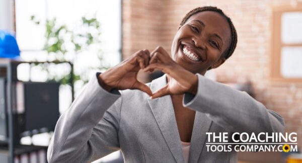 Business Woman making heart shape with hands for loving kindness meditation