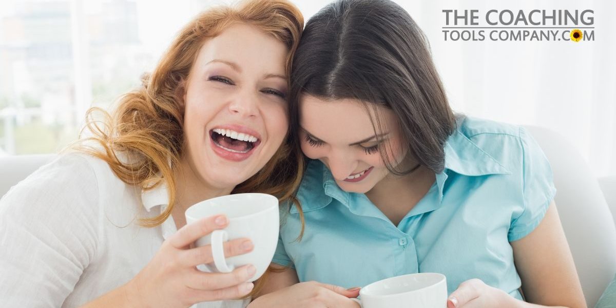 Two-happy-young-female-friends-with-coffee-cups-enjoying-a-conversation-1200-x-628.jpg