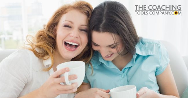 Two-happy-young-female-friends-with-coffee-cups-enjoying-a-conversation-1200-x-628.jpg