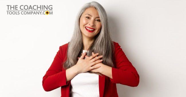 business-concept-mature-asian-woman-with-red-lips-blazer-holding-hands-heart-smiling-thankful-looking-grateful-camera-standing-white-background-1200-x-x628.jpg