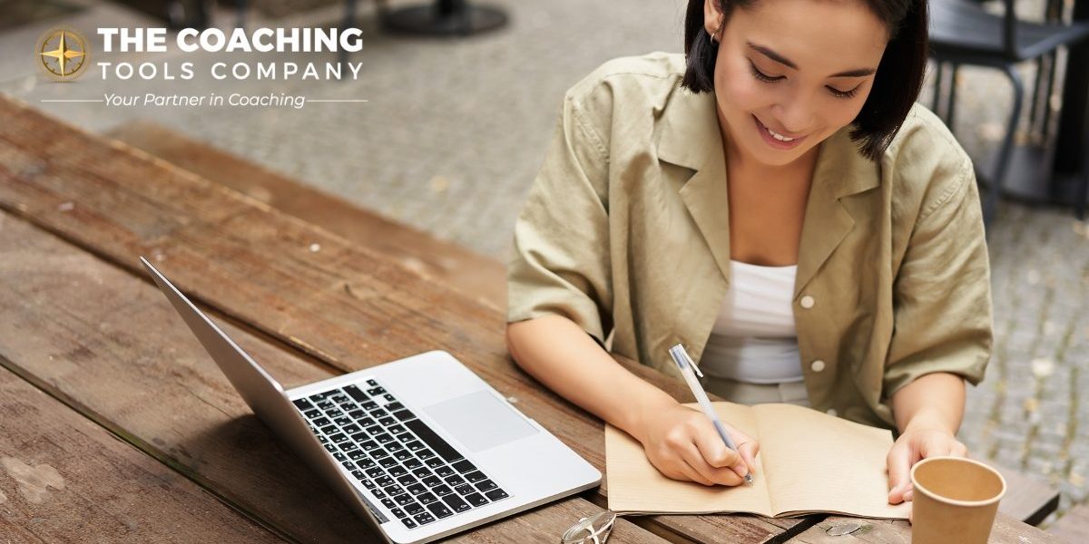 portrait-young-woman-studying-online-sitting-with-laptop-writing-down-making-notes-looking-1200×628-1.jpg